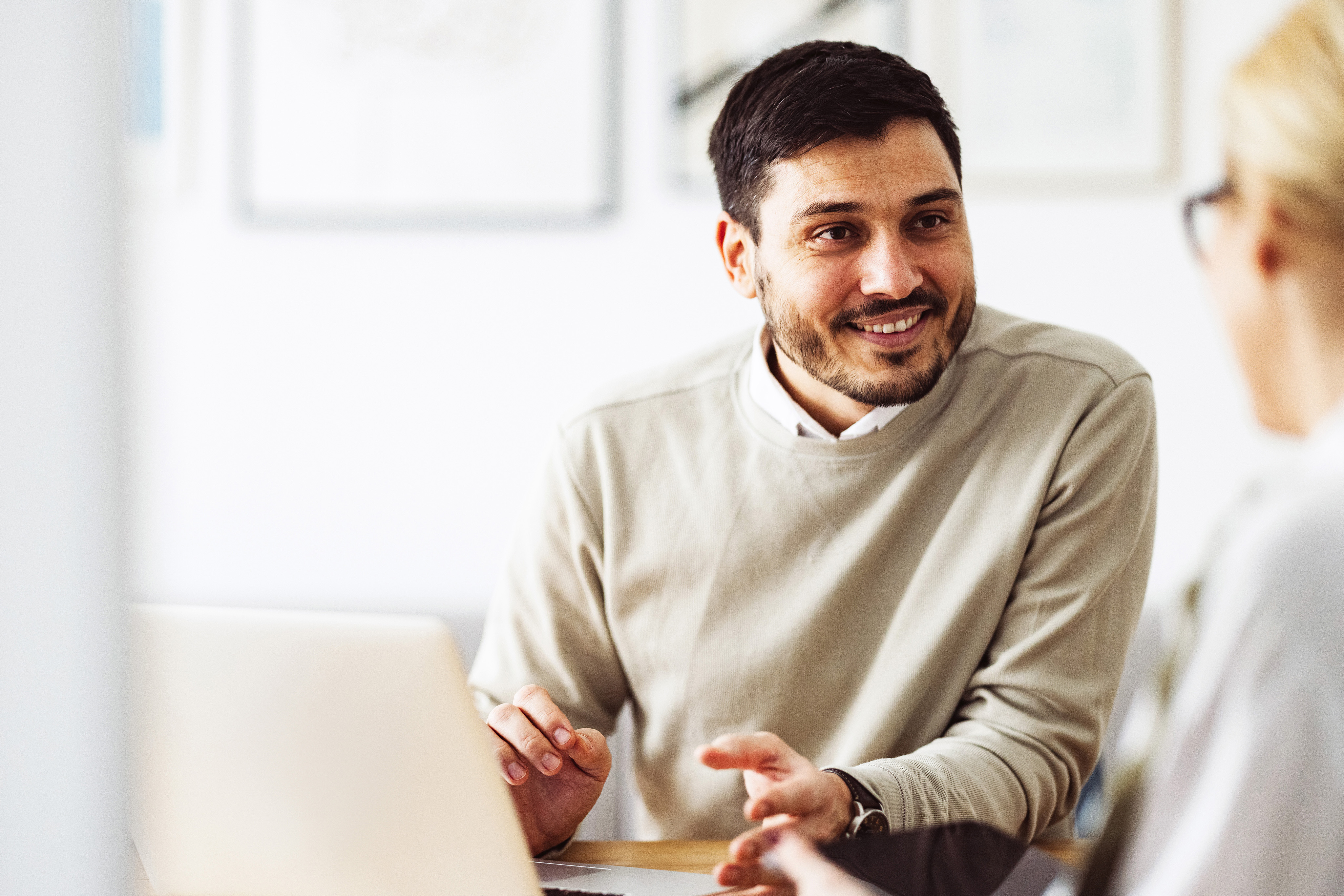 Co-workers at desk, computers