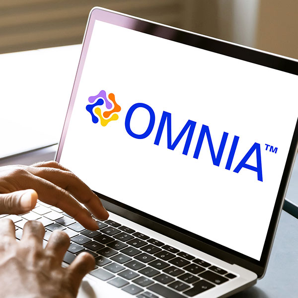 A computer showing the OMNIA™ logo